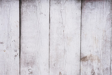 Texture of old shabby wooden planks fence with peeling paint, vintage wooden table surface, aged wooden background