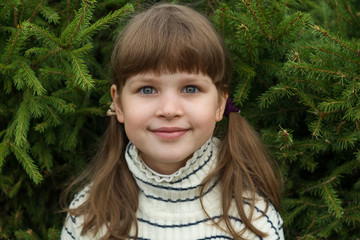 portrait of happy, positive, smiling, playful asian caucasian girl