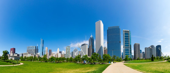 Green meadow on cityscape background of Chicago