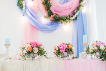 Wedding decor, table setting, floral arrangements in the restaurant