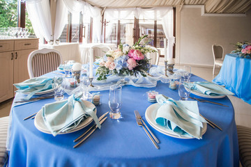 Wedding decor, table setting, floral arrangements in the restaurant