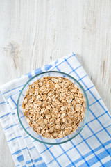 spelt flakes on wooden surface