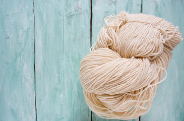 knitting yarn hanks on wooden surface