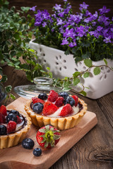 Fresh homemade fruit tart with strawberries and blueberries.