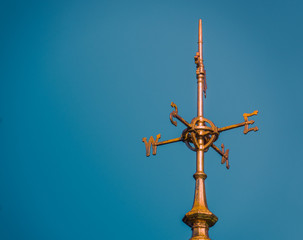 Weathervane Against Blue Sky