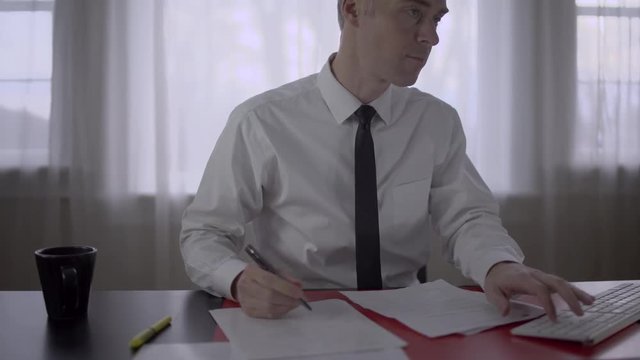 Man doing paperwork in the office