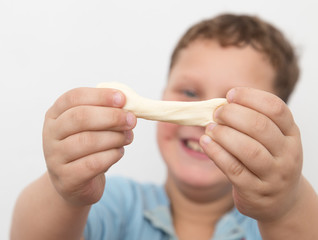 boy with his hands in the dough