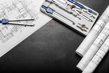 Construction planning drawings on black background