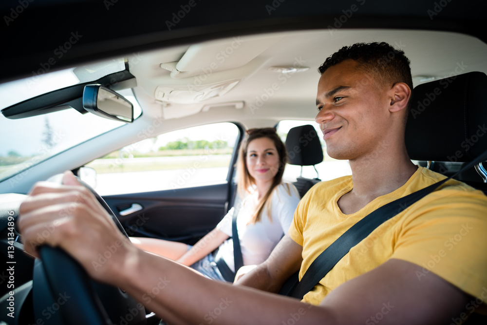 Wall mural traveling in two - couple in car