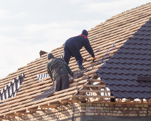workers working on the roof