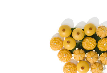 Sweet yellow desert royal Thai cuisine decorated with green leaf on solid white background