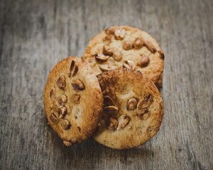Closeup of a group of assorted cookies. Chocolate chip, oatmeal raisin, white chocolate fill the frame.