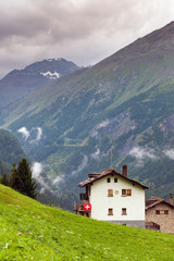 Fototapeta na wymiar House in the beauty of St Moritz, engadin valley . La Sag
