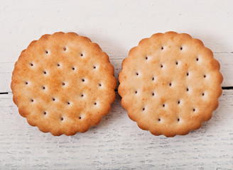 Tasty baked cookies on old wooden background.