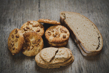 Wheat products: biscuits and bread closeup on a desk