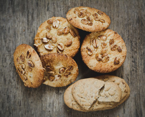 freshly baked chocolate chips cookies with flour, shot from above on an old black baking tray