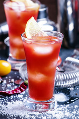 Alcoholic cocktail bloody Joseph with lemon and tomato juice, ic