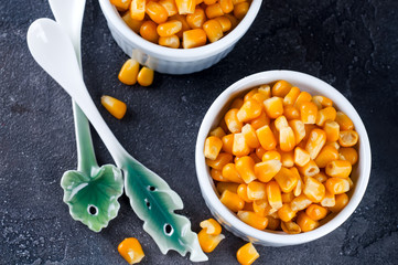 Boiled corn kernels in white cups