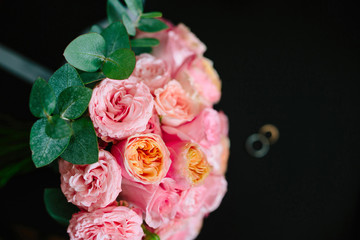 Beautiful bouquet of peony roses on a black background