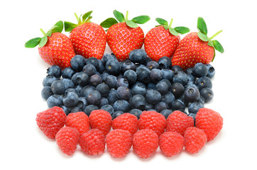 raspberries, blueberries and strawberries on white background