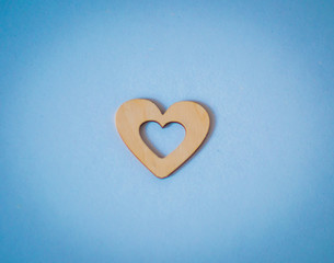 wooden heart on a blue background