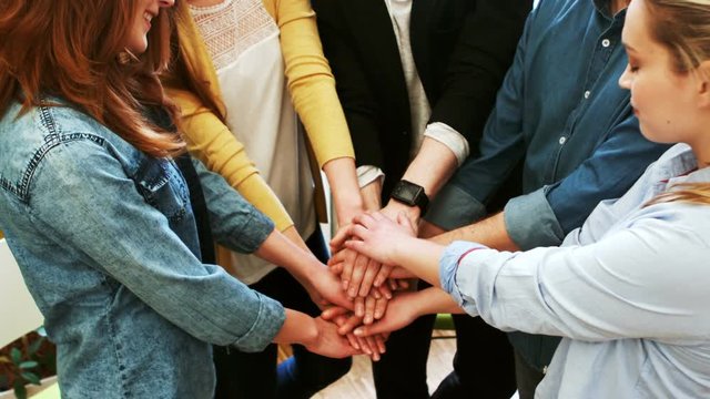 Business executives forming hand stacked