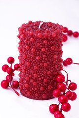 Red candle on a white background