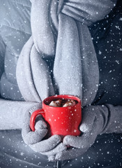 Woman holding a cup of hot chocolate
