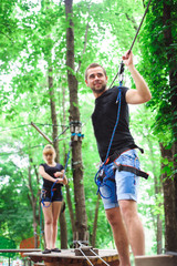 Hiking in the rope park two young people