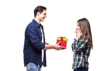 Young couple share gift on white background. Girl get present from her boufriend.