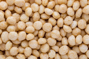 Corn flakes rings on the background.