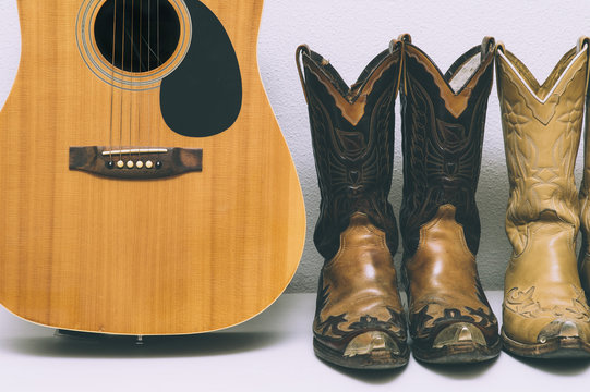Cowboy boots and guitar