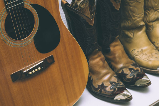 Cowboy boots and guitar