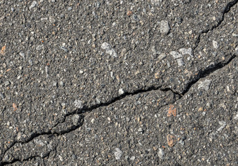 Obraz premium Asphalt with crack background. Old gray road for background or texture. Asphalt as abstract background or backdrop