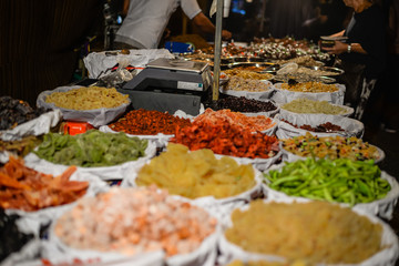 Colorful variety dry fruits and nuts in the street shop vibrant background