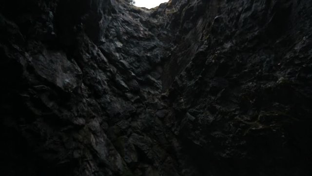 Look at the sky through the hole in the cave