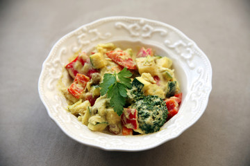 Healthy vegetable cucumber pepper broccoli salad with mayonnaise