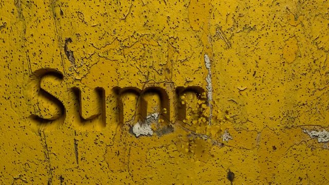 Summer word carved in a yellow stone wall animation