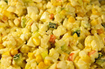 Salad with crab sticks corn cucumber eggs and rice