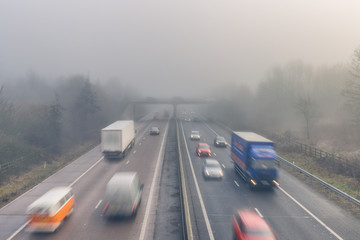 Vehicles on Busy Motorway In Foggy Weather