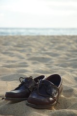 Fototapeta premium Shoes in the sand