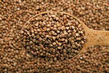 Buckwheat in a wooden spoon