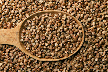 Buckwheat in a wooden spoon