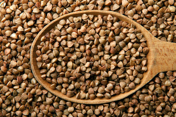 Buckwheat in a wooden spoon