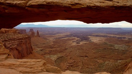 Famous View point in Canyonlands National park looking through Mesa Arch