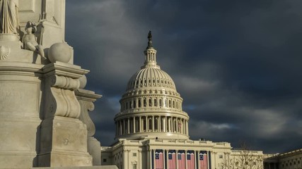 US Capitol building time lapse with ominous storm clouds and American flags.