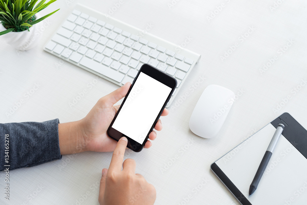 Poster hand hold phone mobile and touching on workspace table