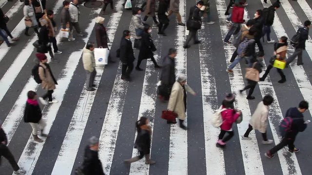 people crossing the street at japan