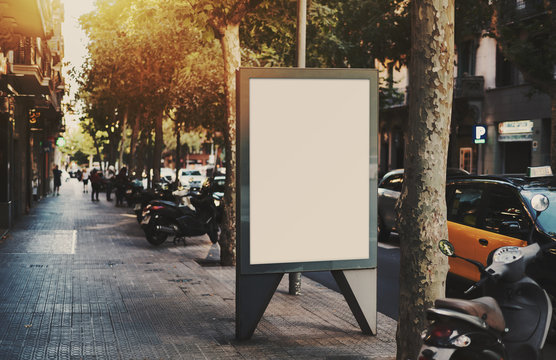 Empty mock up banner for your advertising, blank billboard with copy space area for your text message or promotional content, public information board next to road on summer day