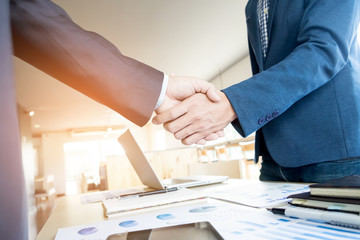 Businessmen shaking hands during a meeting